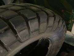 2 Loaded tires on rims and one tire 14.9-24