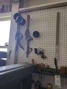 Screw drivers, contents of small shelf, hanging tools