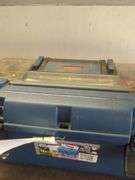 Contents of shelf, rubber made tool box with tools, battery charger, metal tool box, does not include jugs