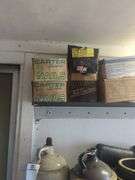 Shelf of nails, caps, and hoses