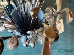 Bin of used golf clubs