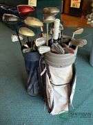 2 sets of rental clubs with bags