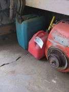 Vintage Kohler gas engine and 2 fuel cans