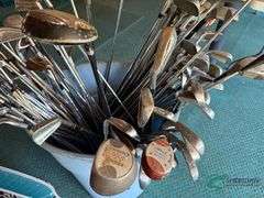 Bin of used golf clubs