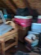 Contents of left half of attic, does not include trains in and on glass case