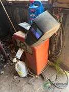 Arc welder with helmet
