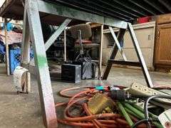 Two iron saw horses