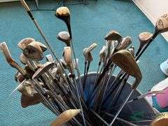 Bin of used golf clubs