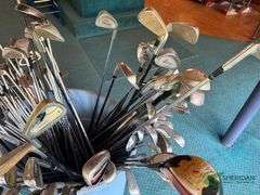 Bin of used golf clubs