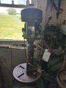 Bench model drill press includes cabinet and contents