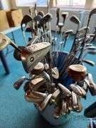 Bin of used golf clubs