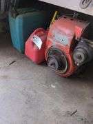 Vintage Kohler gas engine and 2 fuel cans