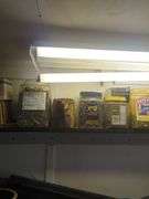 Shelf of nails, caps, and hoses