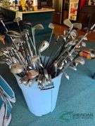 Bin of used golf clubs