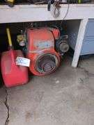 Vintage Kohler gas engine and 2 fuel cans