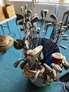 Bin of used golf clubs