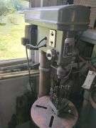 Bench model drill press includes cabinet and contents