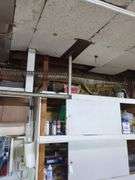 Contents of top shelf, sprayer, metal tool box