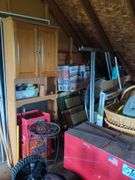 Contents of left half of attic, does not include trains in and on glass case