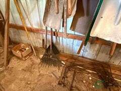 Numerous rakes and shovels