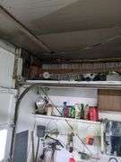 Contents of top shelf, sprayer, metal tool box