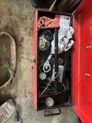 Red toolbox with miscellaneous tools