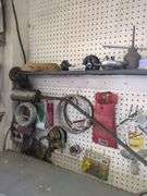 Contents of wall, brazing rod, belts, wire