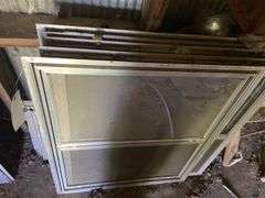 Assorted storm windows and door