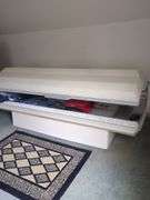 Tanning bed - Located upstairs. Buyer must bring help and responsible for removing