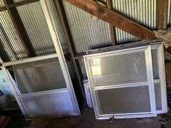 Assorted storm windows and door