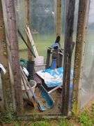 Wooden bench and contents of shed/greenhouse