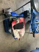 Tarps, auto trim items, and 2 DeSoto hubcaps