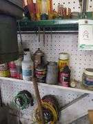 Screw drivers, contents of small shelf, hanging tools