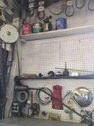 Contents of wall, brazing rod, belts, wire