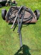 Irrigation pipes pieces and yard trailer