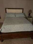 Queen size bed.  In basement bring help to load out.