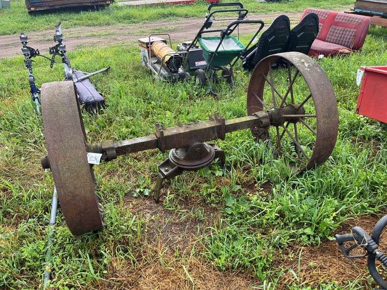 (2) heavy steel wheels on axle, row:10 image