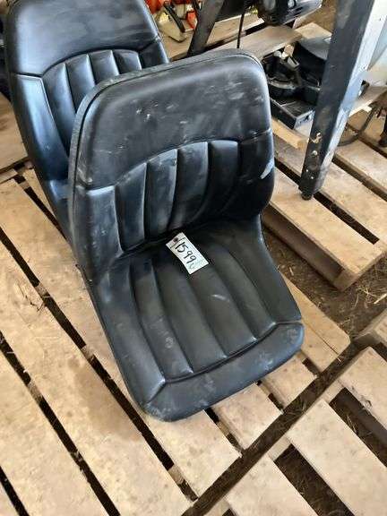 (2) tractor seats- owner states unused, bldg:locked image