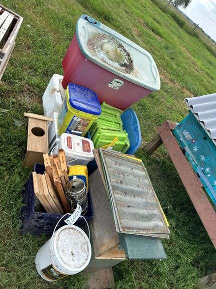 Pile of frames and misc equipment for bees, row:10 image