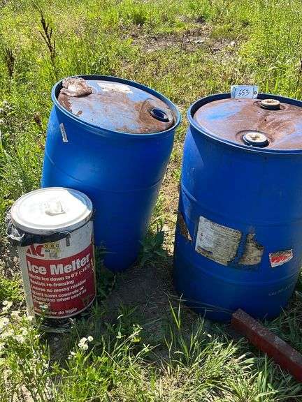 Ice melt and two blue barrels image