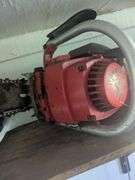 Red super X chainsaw