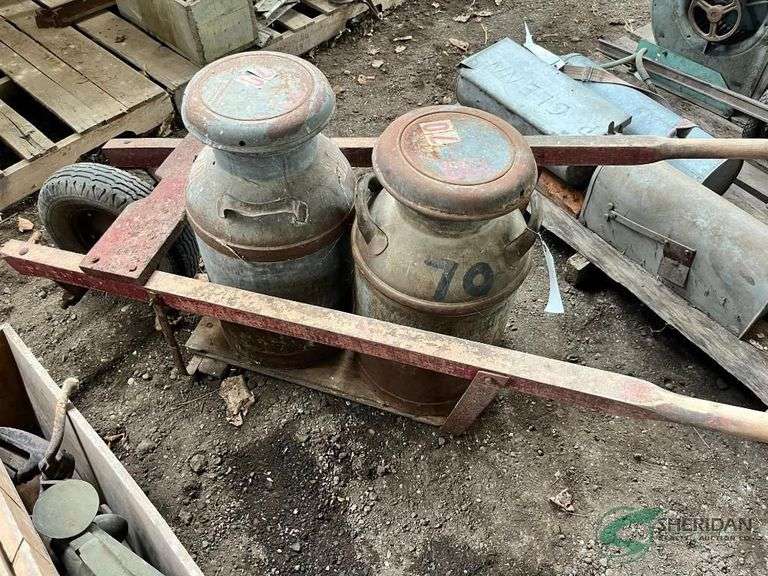 Milk can cart and pair of milk cans image