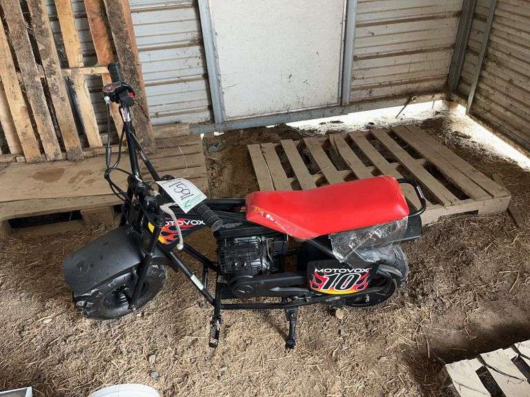 Motovox mini bike, owner states like brand new, bldg:locked image