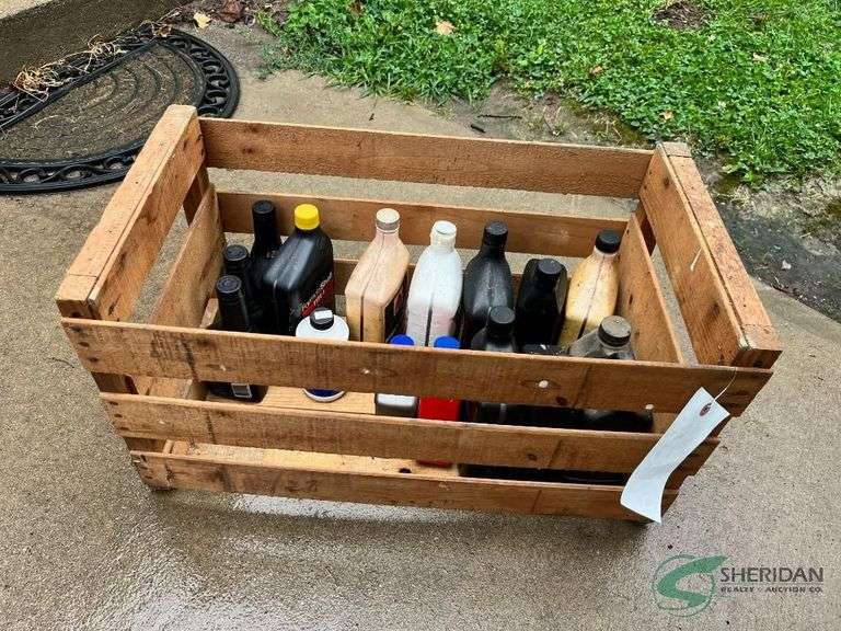 Wooden crate of various oils image