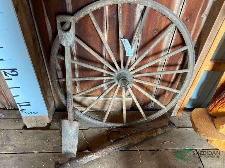 Evener, wood spoke wheel, and vintage shovel image