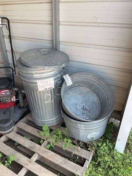 (2) Metal trashcans with lids, (3) galvanized steel tubs, bldg:green image