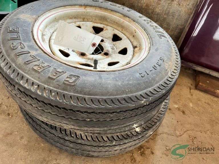 Set of 5.3-12 Trailer tires and rims, 4 bolt image