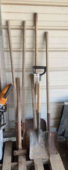 Assorted lawn tools- shovels, post hole digger, etc. bldg:green image