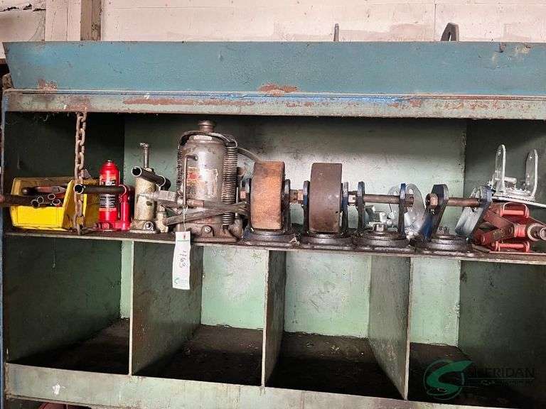 Contents of shelf, bottle jacks, air/hydraulic jack and casters image