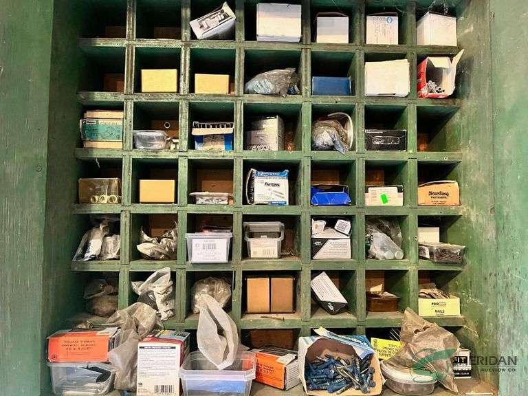 Contents fo Fasteners in wooden storage cabinet image